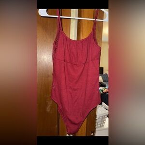 Red cotton body suit with lace on back shoulder blades